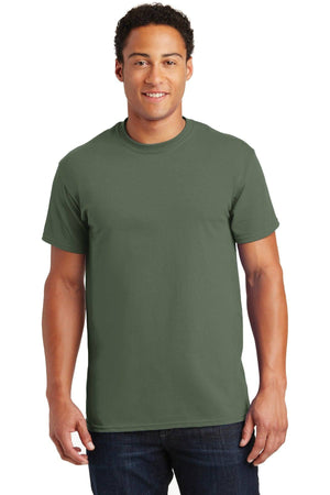 A person wearing a Gildan 100% US Cotton T-Shirt 2000 in plain green stands facing the camera against a white background.