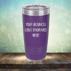 Custom Logo 20 oz Tumblers by Kodiak Coolers - SPECIAL OFFER - Front side Logo Included displayed on a wooden surface with a bokeh background.