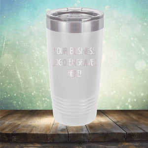 Stainless steel tumbler with Kodiak Coolers logo engraved on wooden surface with bokeh background, perfect as a promotional gift.