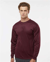 A man wearing a C2 Sport Performance Long Sleeve T-Shirt.