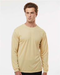A man in a light beige C2 Sport Performance Long Sleeve T-Shirt, made from antimicrobial fabric, stands against a plain white background.