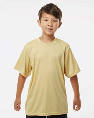 A young boy wearing a yellow C2 Sport Youth Performance T-Shirt.