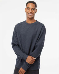 A man in an Independent Trading Co. Midweight 100% Cotton Crewneck Sweatshirt SS3000 smiling.