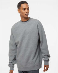 A man wearing a grey Independent Trading Co. midweight 100% cotton crewneck sweatshirt SS3000 with split stitch double needle sewing on all seams.