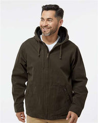 A man wearing a Dri Duck Laredo Boulder Cloth Canvas Jacket with Thermal Lining with a hood made of heavyweight cotton.
