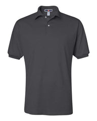 Experience the JERZEES Midweight Polo Cotton Poly Blend 50/50 in sleek black, featuring short sleeves and a collared neckline with two buttons. Enhanced with SpotShield technology for superior stain resistance, this polo is perfect for both casual wear and bulk custom embroidered orders.