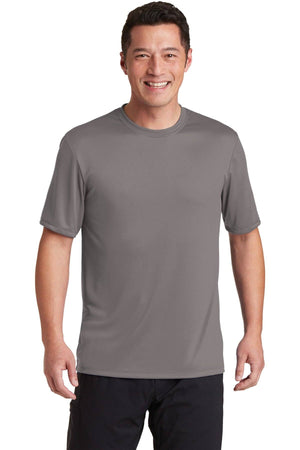 A person wearing a Hanes Cool Dri Performance T-Shirt 4820 in gray and dark pants is smiling while standing.
