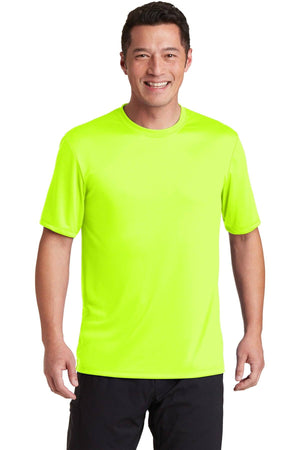 Wearing a customized Hanes Cool Dri Performance T-Shirt 4820 in neon yellow and black pants, a person smiles against a plain white background.