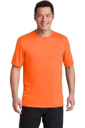 A person in a customized Hanes Cool Dri Performance T-Shirt 4820 and black pants smiles against a white background.