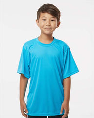 A young boy wearing a C2 Sport Youth Performance T-Shirt.