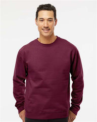 A man wearing an Independent Trading Co. Midweight 100% Cotton Crewneck Sweatshirt SS3000 made of a cotton/polyester blend fleece fabric.