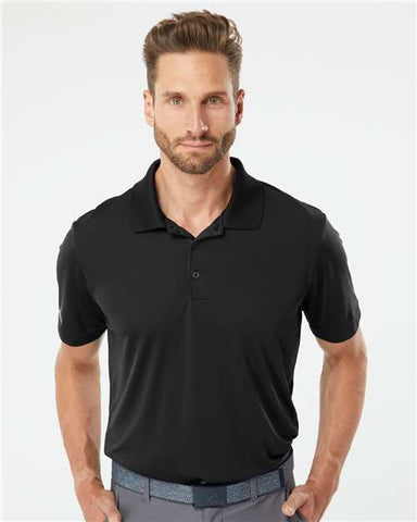 A man wearing an Adidas Lightweight Performance Polo 100% Recycled Polyester.