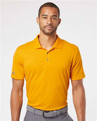 A man wearing an Adidas Lightweight Performance Polo made from 100% recycled polyester.