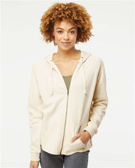 A woman wearing an Independent Trading Co. Women's California Wave Wash Full-Zip Hoodie Sweatshirt.