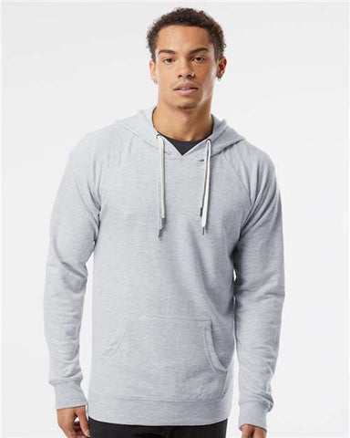 A man wearing an Independent Trading Co Icon Unisex Lightweight Loopback Terry Hoodie Sweatshirt.