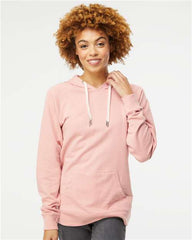 A woman wearing an Independent Trading Co Icon Unisex Lightweight Loopback Terry Hoodie Sweatshirt in pink, customized with company logo branding. She pairs it with jeans.
