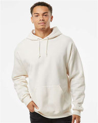 A man wearing a Jerzees NuBlend Hoodie Sweatshirt made of cotton/polyester fleece.