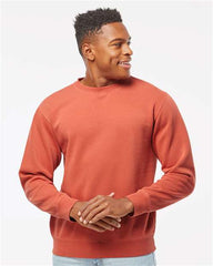 A man wearing a customized Independent Trading Co. Midweight Pigment-Dyed Crewneck Sweatshirt creates a strong impression with his branding.