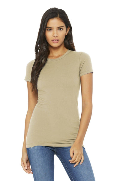 A person wearing a beige Bella + Canvas Women's Slim Fit T-Shirt BC6004, crafted from soft Airlume cotton, paired with slim-fit blue jeans, stands against a plain white background.