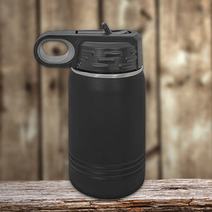Black Kodiak Coolers vacuum-sealed insulated water bottle with a flip-top lid on a wooden surface.