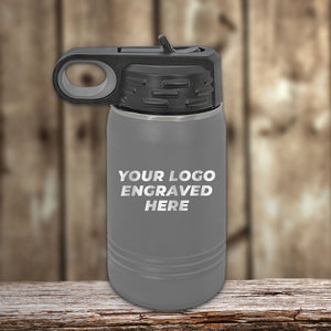 A youthful gray Custom Kids Water Bottle 12 oz Personalized with your Logo, Design or Names - Special Bulk Wholesale Volume Pricing by Kodiak Coolers with a flip top straw and your custom logo laser-engraved on it.