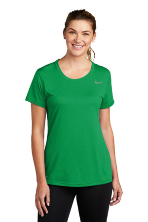 Woman wearing a green Nike Ladies Legend T-Shirt CU7599, smiling at the camera.