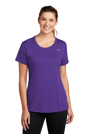 Woman in a Nike Ladies Legend T-Shirt with Dri-FIT technology, smiling at the camera.