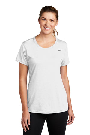 Woman wearing a white Nike Ladies Legend T-Shirt CU7599 with Dri-FIT technology, smiling at the camera.