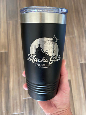 A Kodiak Coolers custom black tumbler with the laser engraved words "Mac's Gulf" and a business logo on it.