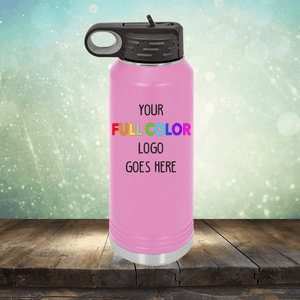 A pink insulated water bottle with a black lid and carrying loop is placed on a wooden surface. The text on the bottle reads "Custom UV Printed Drinkware - ONE TIME SPECIAL OFFER." A glittery background adds a touch of sparkle, reminiscent of the elegance found in Kodiak Coolers custom coffee mugs or engraved tumblers.