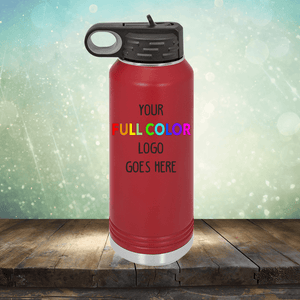 A red Custom UV Printed Drinkware - ONE TIME SPECIAL OFFER with a black lid is displayed on a wooden surface against a blurred background. The drinkware, much like customizable coffee mugs, has the text "Your Full Color Logo Goes Here" printed on it by Kodiak Coolers.