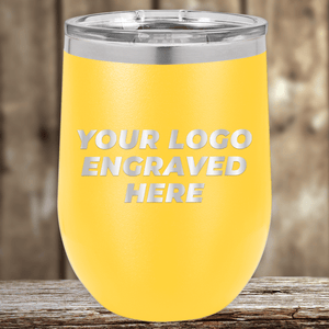 The Kodiak Coolers Realtor Closing Gifts for Clients tumbler features your custom company logo engraved on drinkware—a standout promotional item against a wooden background, perfect for showcasing your brand.