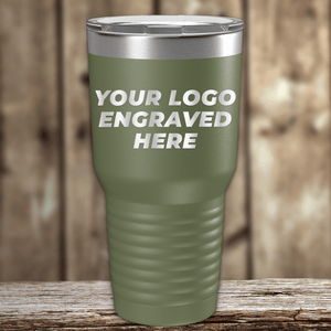 A Kodiak Coolers tumbler with your custom company logo engraved is displayed on a wooden surface—an ideal Realtor closing gift for clients and a standout choice for personalized drinkware.