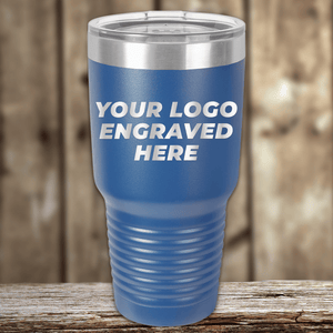 A blue Kodiak Coolers tumbler with a clear lid, engraved with your custom company logo—ideal as a Realtor closing gift for clients or anyone wanting personalized drinkware.