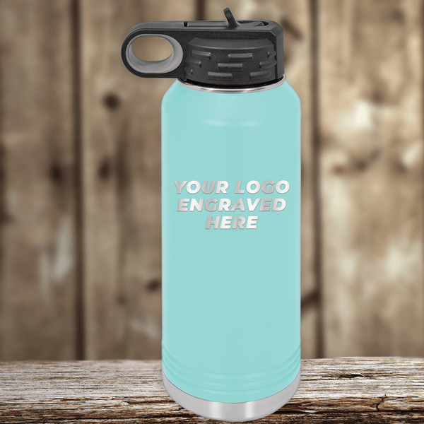 https://www.kodiak-wholesale.com/cdn/shop/products/New_Background_-_Your_Business_Logo_-_32_oz_Water_Bottle_-_Teal_51e943d1-d5fb-46ab-81ed-62f44bc7accc_600x.png?v=1669851111