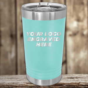 A light blue stainless steel tumbler from Kodiak Coolers with a clear lid and your custom company logo engraved—ideal as a realtor closing gift or branded drinkware to showcase your business.