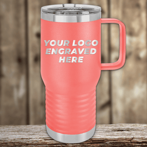A pink insulated travel mug by Kodiak Coolers sits on a wooden surface, featuring "Your Custom Company Logo Engraved"—the ideal Realtor closing gift or unique promotional drinkware for clients.