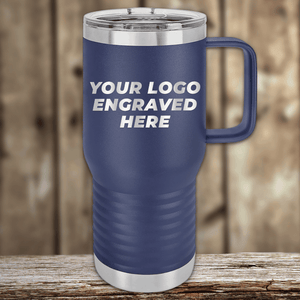 A blue Kodiak Coolers travel mug with a handle sits on a wooden surface, displaying "YOUR LOGO ENGRAVED HERE"—Realtor Closing Gifts for Clients with your custom company logo engraved on drinkware. Ideal for promotional or personalized gifts.