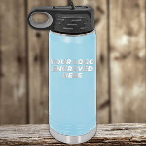 A light blue Kodiak Coolers stainless steel water bottle with a black lid, engraved with your custom company logo—perfect as realtor closing gifts for clients and ideal for promotional drinkware collections.