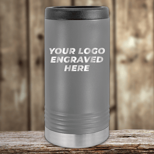 A gray Kodiak Coolers tumbler with "YOUR LOGO ENGRAVED HERE" on the front, ideal as a Realtor Closing Gift for Clients. Your custom company logo can be engraved on this promotional drinkware.