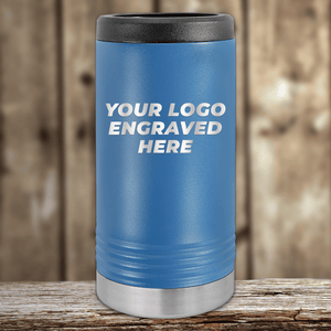 A blue Kodiak Coolers tumbler with a black lid and metallic base, engraved with your custom company logo, ideal as a Realtor Closing Gift for clients. Perfect for showcasing branded drinkware on a wooden surface.