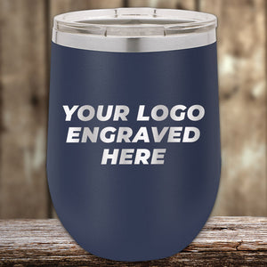 Navy blue insulated stemless wine cup with customizable engraved logo on wooden surface. 
Product Name: Kodiak Coolers Custom Wine Cups 12 oz with your Logo or Design Engraved - Low 6 Piece Order Minimal Sample Volume