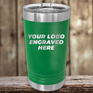 Green insulated Custom Pint Tumblers 16 oz with Slider Lid from Kodiak Coolers, featuring double-walled insulation and a customizable logo area on a wooden surface.