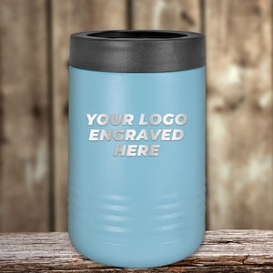 Customizable Kodiak Coolers blue insulated tumbler on a wooden surface with placeholder text for an engraved logo.