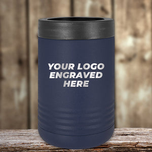 The Kodiak Coolers Engraved Custom Logo Drinkware features single-side engraving included in the price, ideal for business promotional gifts. Shown is a navy blue can holder with "YOUR LOGO ENGRAVED HERE" on a wood background. Bulk pricing available.