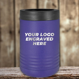 Purple insulated can holder with your logo or design engraved, displayed on a wooden surface with a blurred wooden backdrop by Kodiak Coolers.