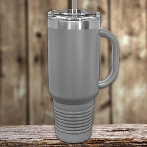 A Kodiak Coolers custom 40 oz travel tumbler with built in handle and straw, with your logo laser-engraved on it, making it the perfect promotional gift.