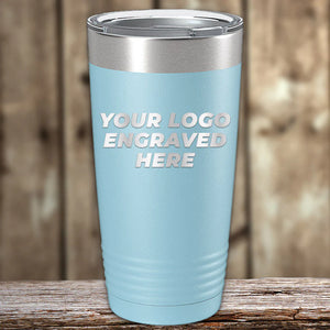 A light blue insulated tumbler with a placeholder for custom engraved logo, ideal for promotional materials. Get the Kodiak Coolers Custom Tumblers 20 oz with your Logo or Design Engraved - Special Bulk Wholesale Pricing.