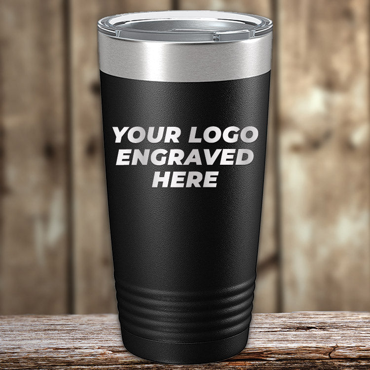 The Kodiak Coolers Engraved Custom Logo Drinkware features single-side engraving ("YOUR LOGO ENGRAVED HERE") in white on a black tumbler with a silver rim—ideal for bulk orders and perfect for showcasing your personalized brand.