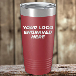 Red Custom Tumblers 20 oz with your Logo or Design Engraved - Special Bulk Wholesale Pricing by Kodiak Coolers displayed on a wooden surface.